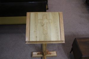 up close look at top of podium with a cross carved into it