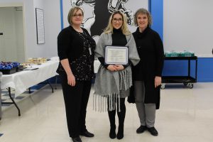 Board award recipient Brittany Harden poses with her certificate 