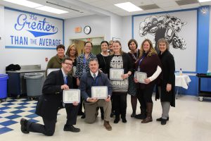 The Empire Coordinators pose and smile displaying the certificates they received at the Board Awards 