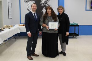 Board Award recipient Gernilee Schombs poses while holding her award