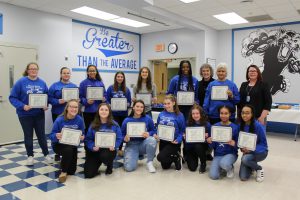 The Monticello Girls Tennis Team poses together after receiving their Scholar Athlete distinction at the Board Awards ceremony 