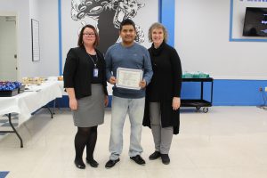 Jose Gallo holds the certificate he received at the Board Awards ceremony 