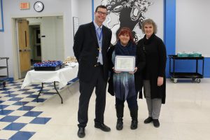 Board Award recipient Patricia Murphy holds the certificate that she received at the Board Awards ceremony 