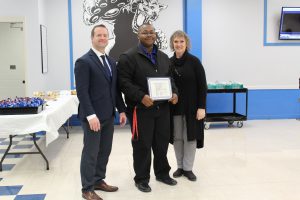 Student Board Award recipient Tylan Williams holds the certificate that he received at the Board Awards ceremony 