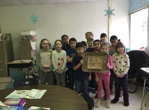 the students who received the lunch award at Kenneth L. Rutherford Elementary School hold up their award 