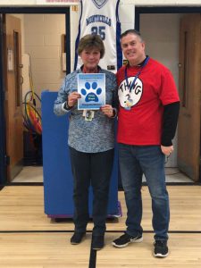 Kenneth L. Rutherford February Employee of the Month, Cindy Shope stands in the gym next to assistant principal Doug Murphy 