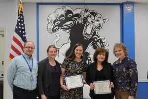 The cafeteria staff at Cooke hold their Board Award certificates during the Board Award ceremony 