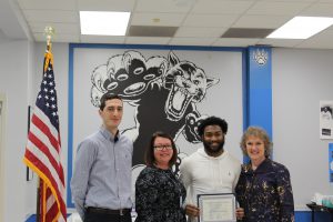 Scholar Athlete Josh Gattling poses with his scholar athlete certificate