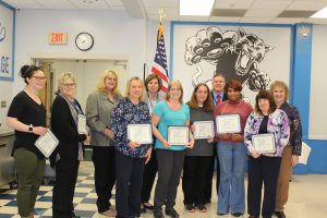 Board Award recipients from Rutherford Elementary School stand holding their certificates 