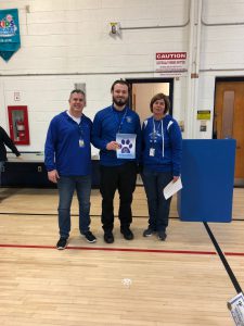 Sean Reuss stands in between Principal Knowlton and Assistant Principal Doug Murphy during Fun Friday 