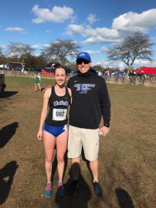 Sarah Grodin stands with her coach 