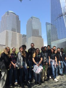 academy of finance students stand in front of buildings in NYC