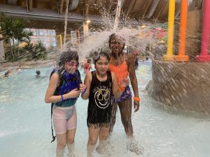 three students get splashed 