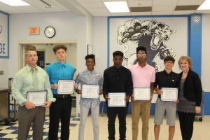 the members of the boys track team that earned scholar athlete status