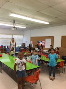 students standing in a classroom 