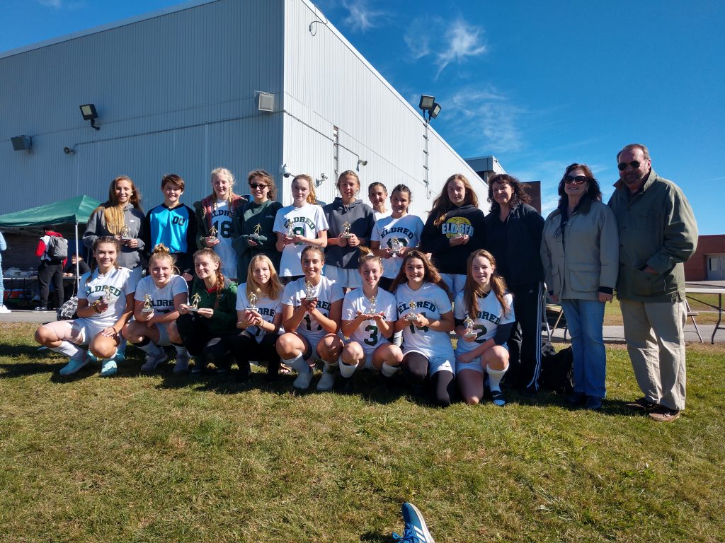 the Eldred girls soccer team poses 