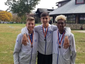 three monticello athletes show off their medals 