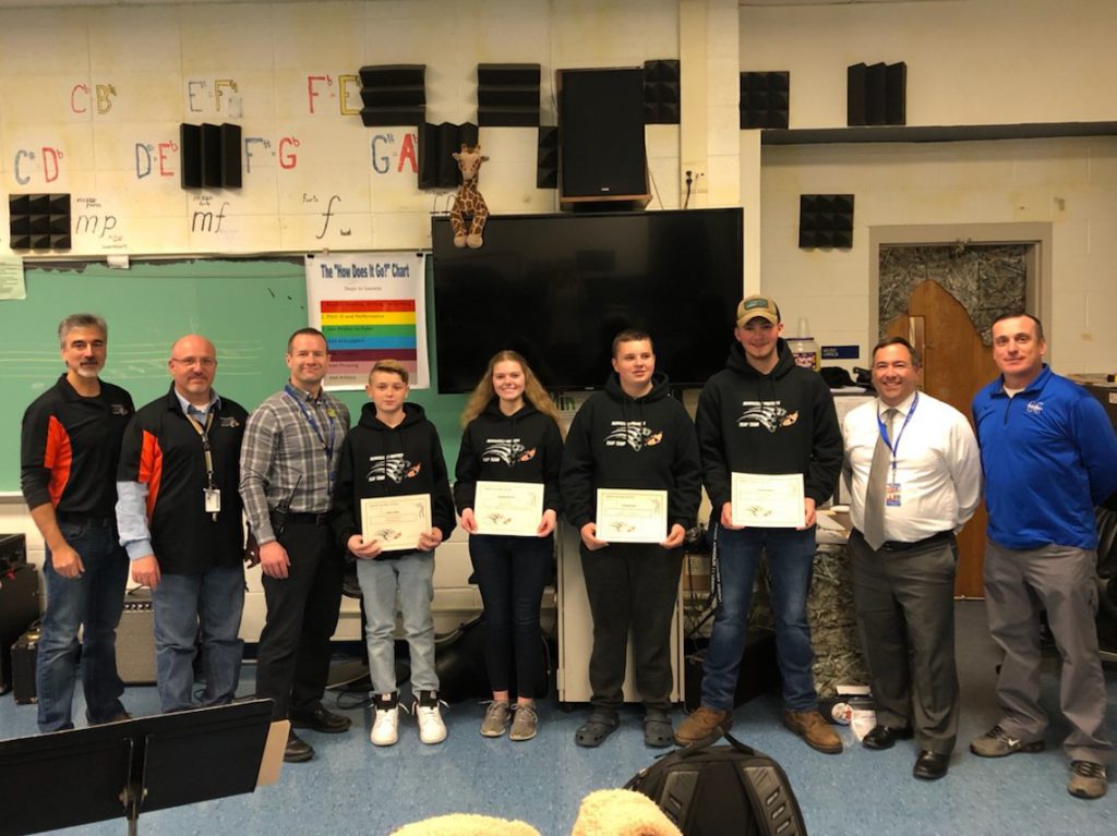 trap team award members pose with administrators