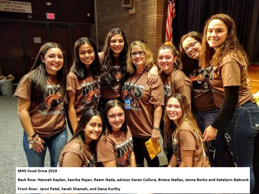 a group of students pose with advisor karen collura 