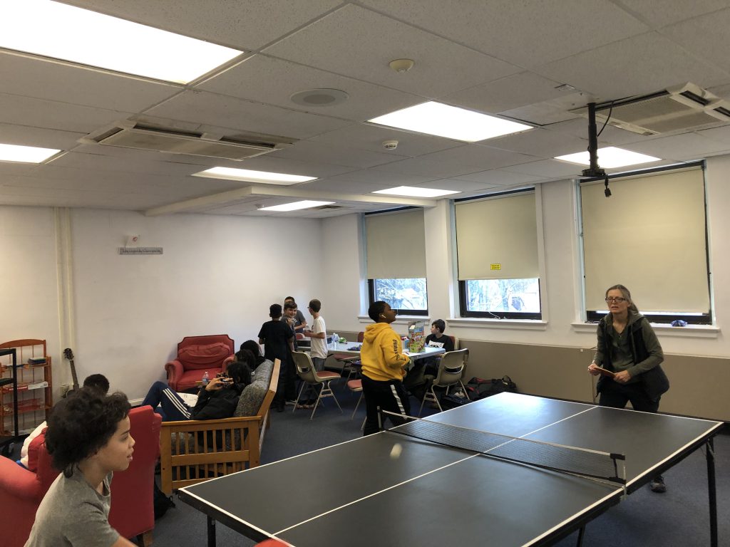 students play ping pong at the hub 