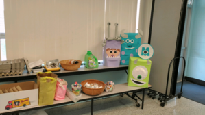 several monster creations are on a display table 