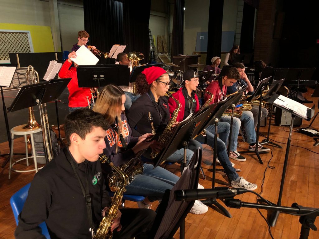 a group of students playing instruments 