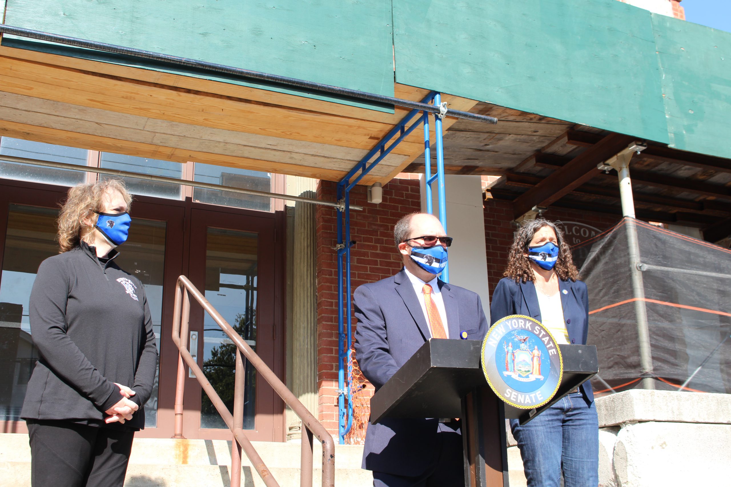 Superintendent of Schools Dr. Matthew Evans is standing at a podium