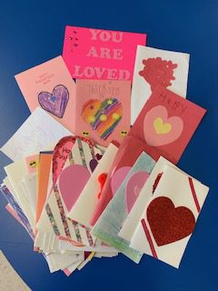 a pile of homemade valentines day cards is lying on a table 