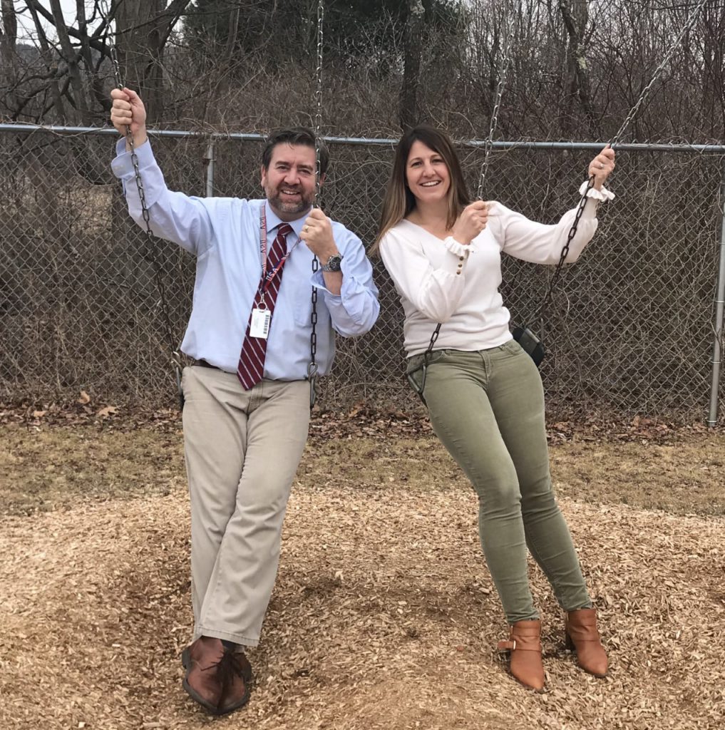 Ginny and Bill on swings 