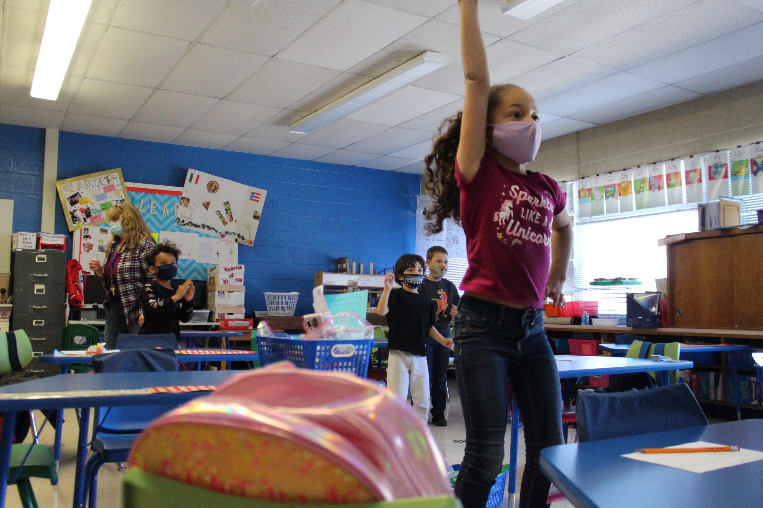 a girl is jumping up in the air and dancing 