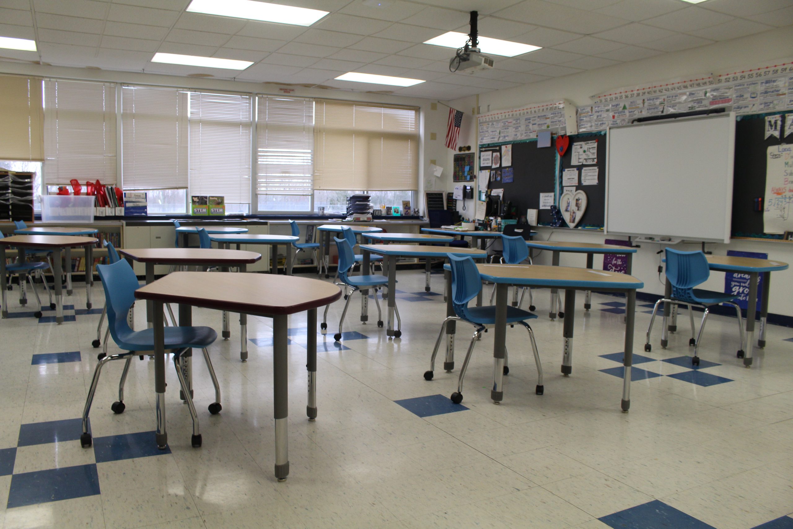 a group of crescent shaped desks