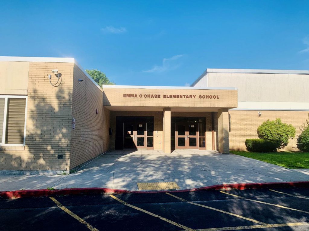 TAn brick building with the wordsEmma C. Chase Elementary School written across the top 