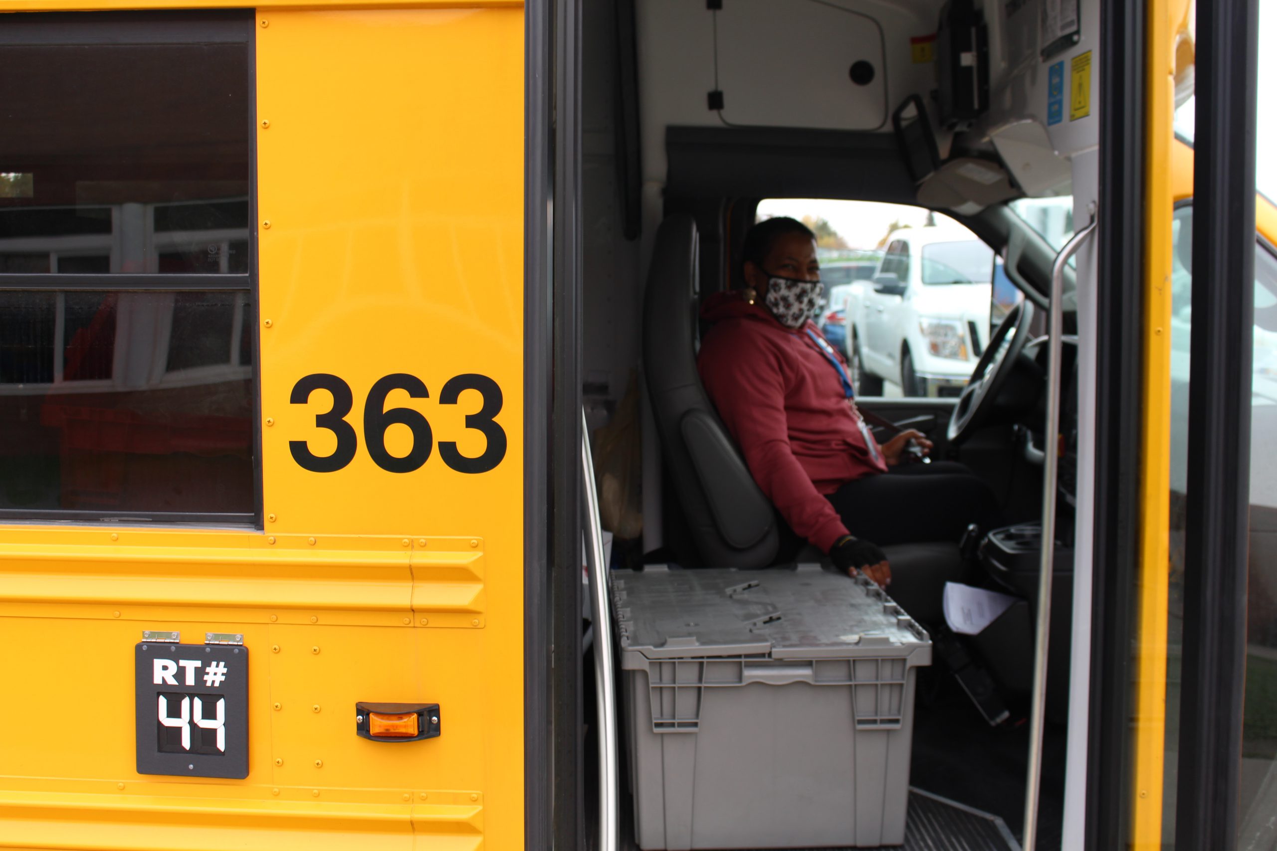 a bus driver is sitting in the drivers seat on a bus