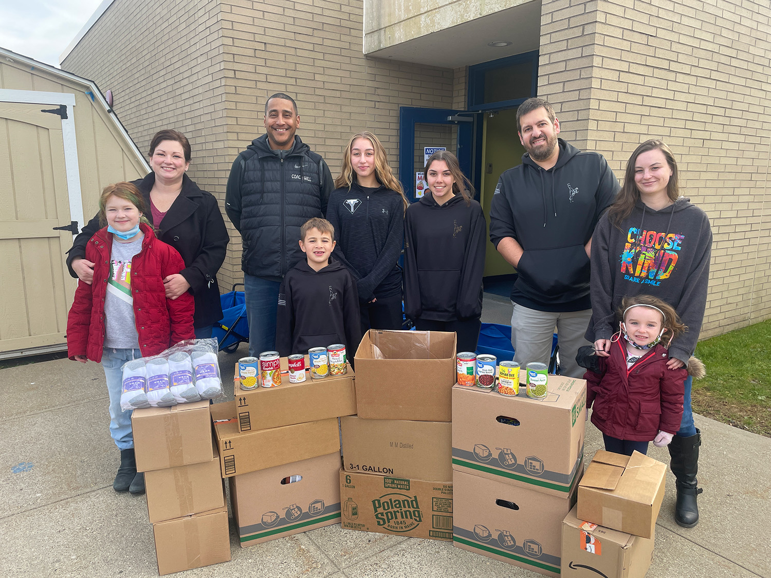 Team TKD posing for group picture with their food donations.