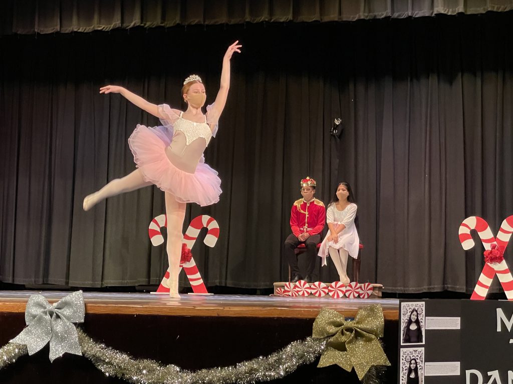 a scene from the Nutcracker performance. The sugar plum fairy is in the foreground