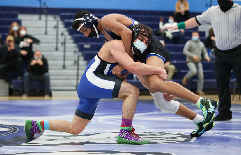 two males are wrestling 