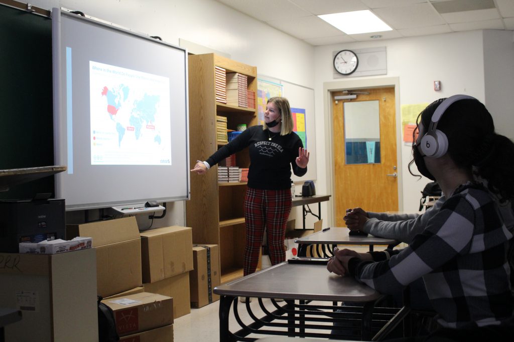 a student is leading a presentation to a classroom 