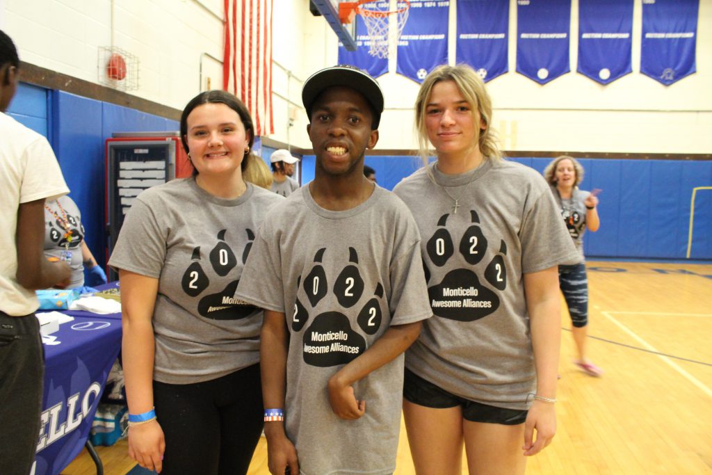 three students are posing 