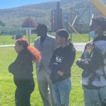 a group of students are standing outdoors