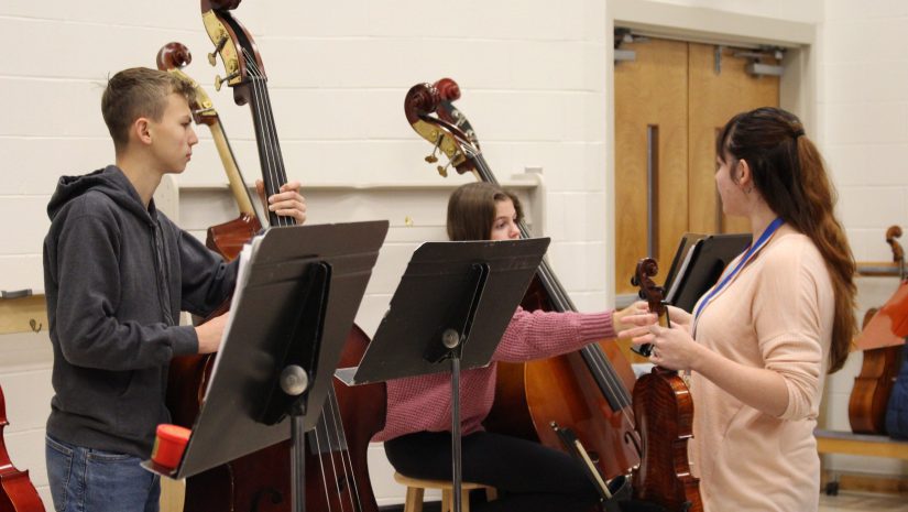 students are playing cello