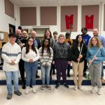 music students are posing with potsdam brass quintet members