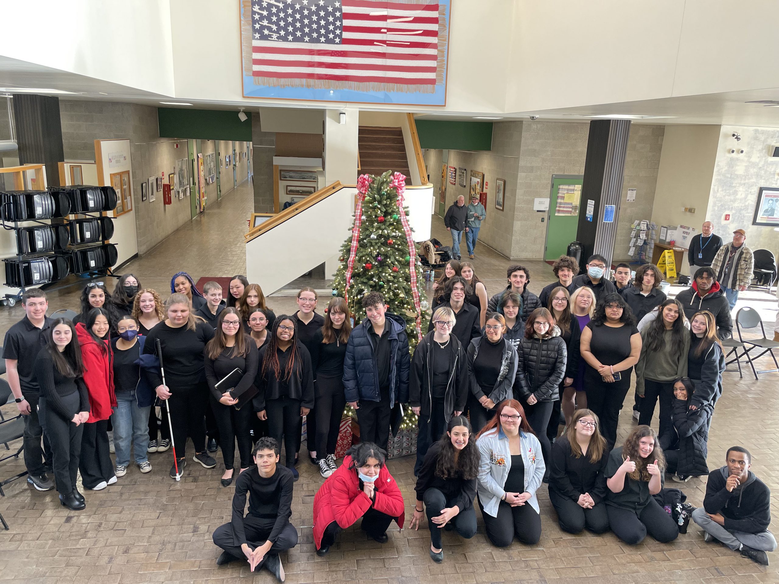 a large group of music students are posing.