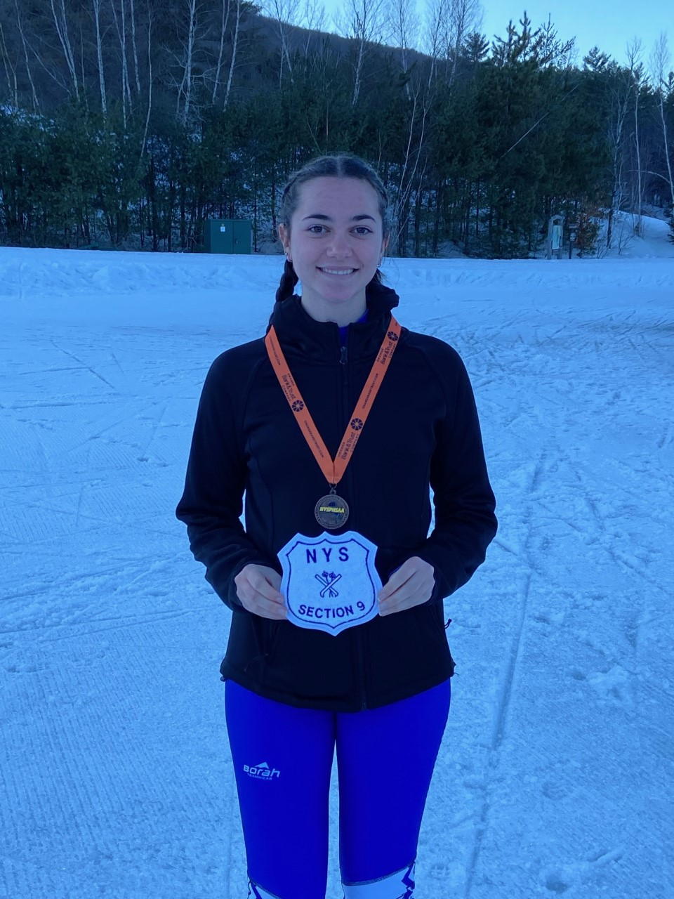 Kaitlyn Morse poses with her medals 