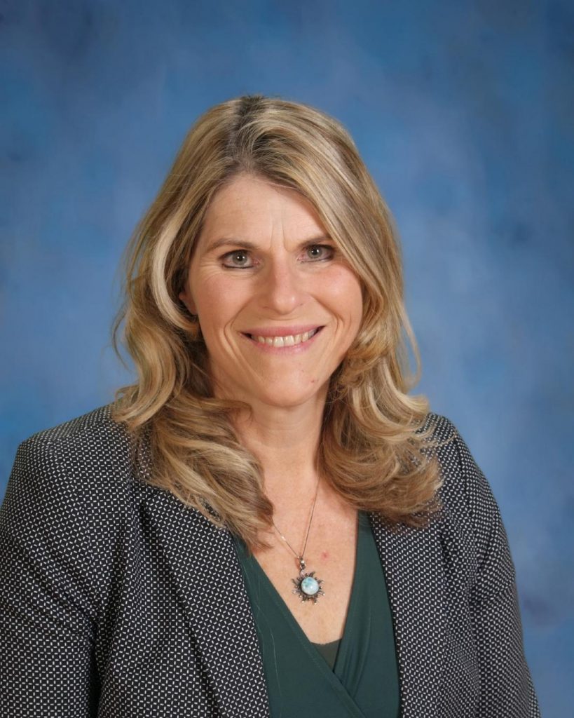 District Theresa Carlin as interim assistant superintendent for curriculum and