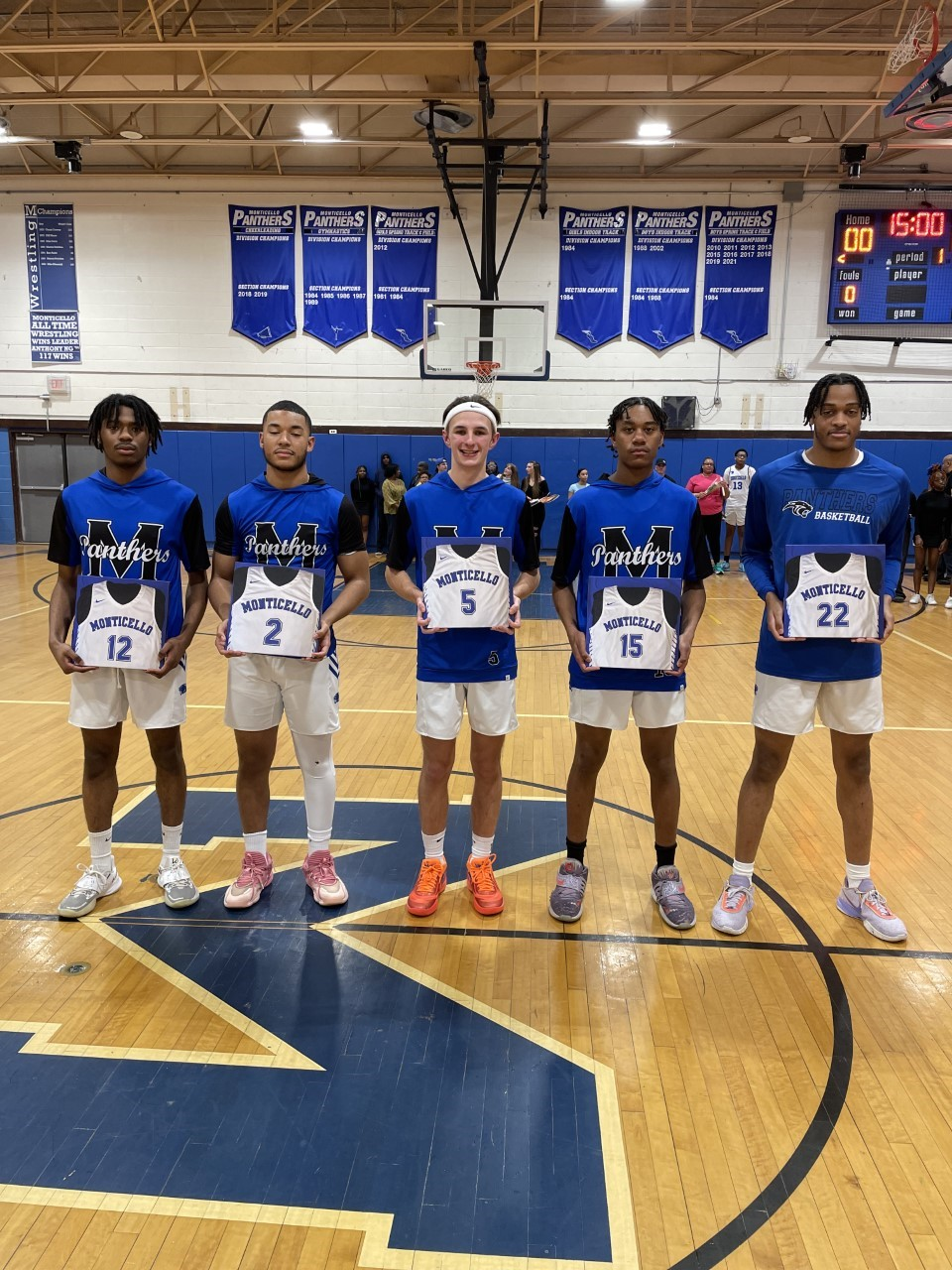 the senior athletes on the boys basketball team pose