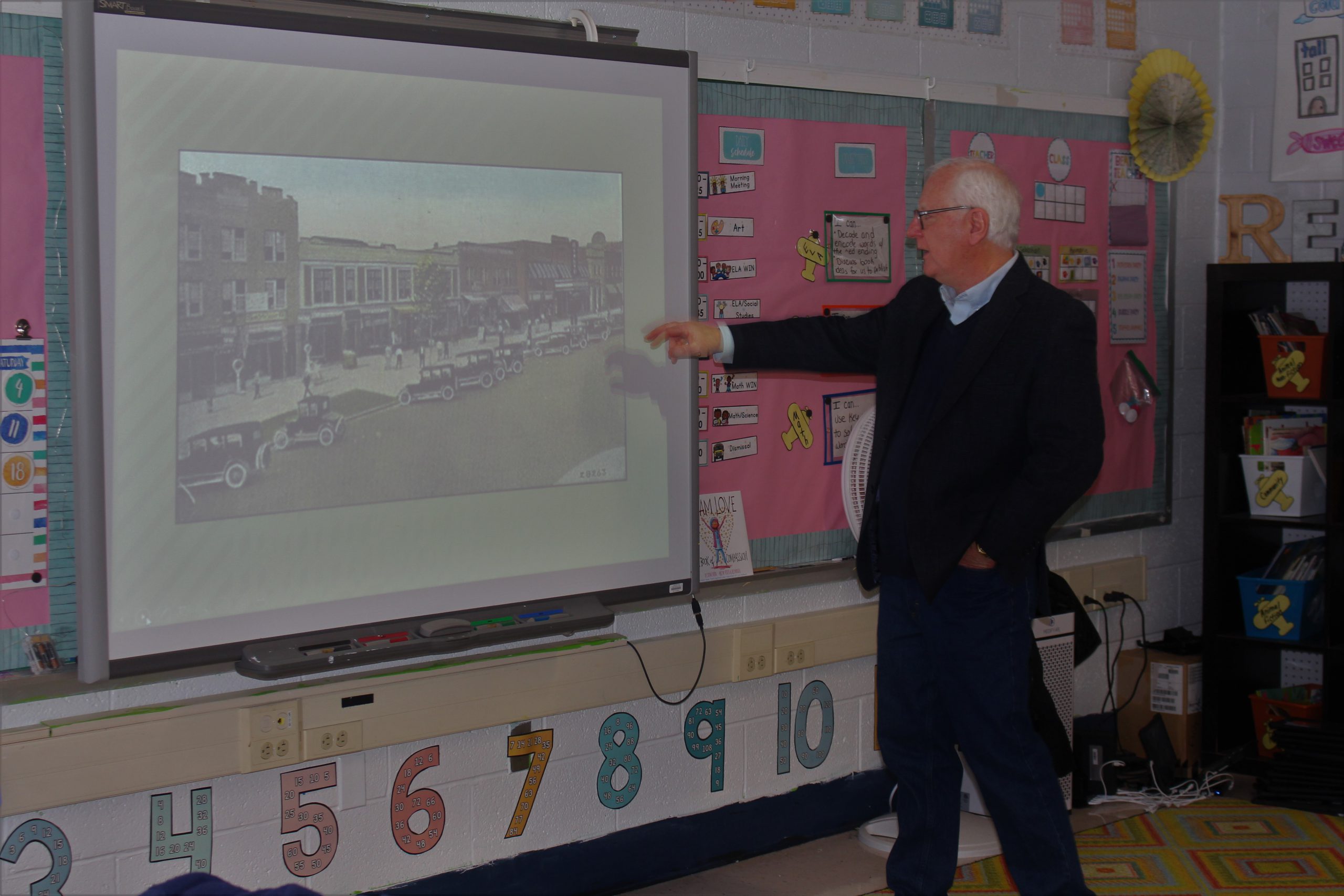 Sullivan County Historian John Conway points to a slide showing Broadway in Monticello many years ago. 