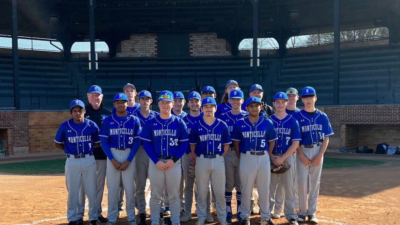 the baseball team is posing on a field