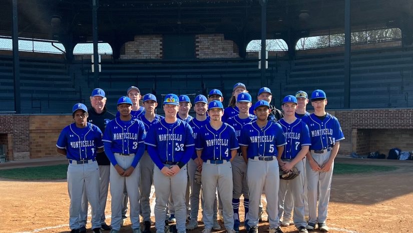 the baseball team is posing on a field