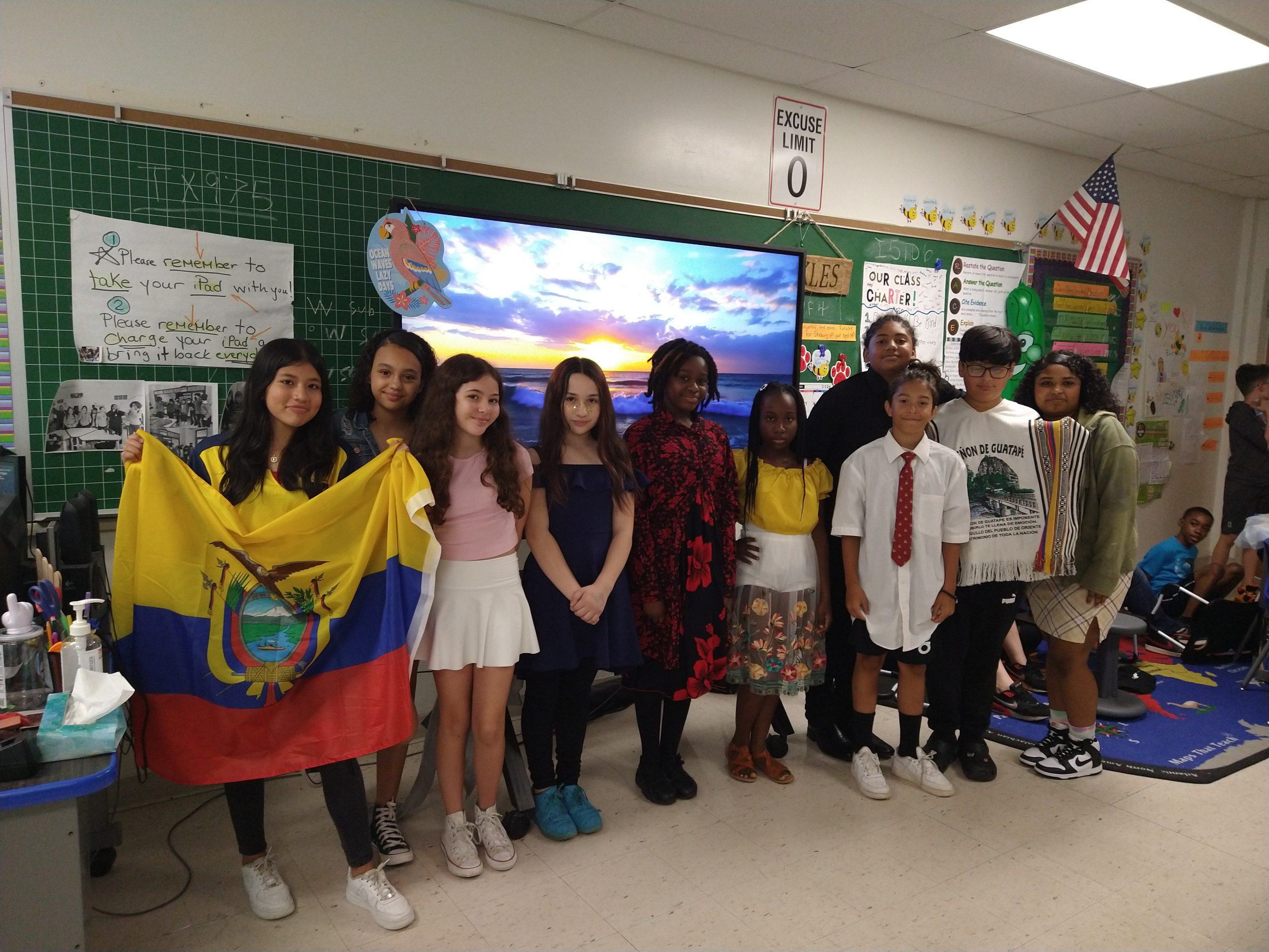 a group of students are posing and holding up flags 