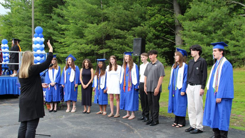 a group of students are singing